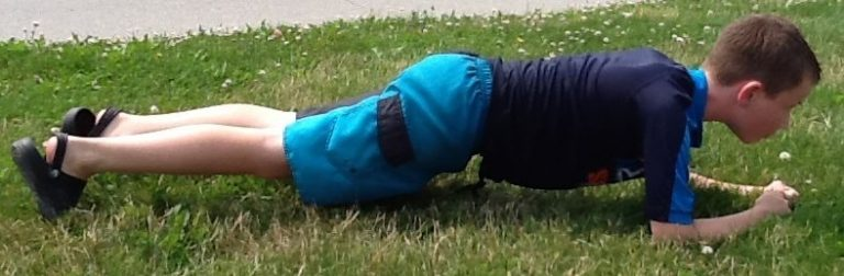 child doing plank exercise 1