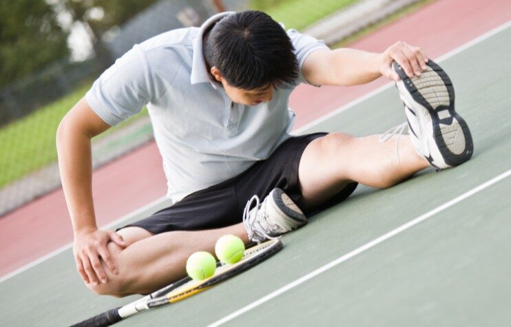 Young Tennis Athlete Stretching on the Court