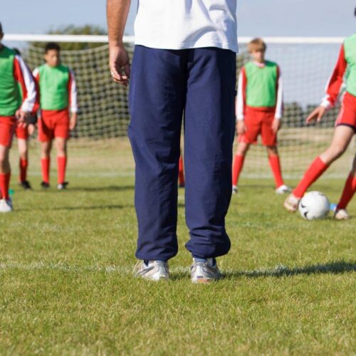 coach doing motivational drills with their team
