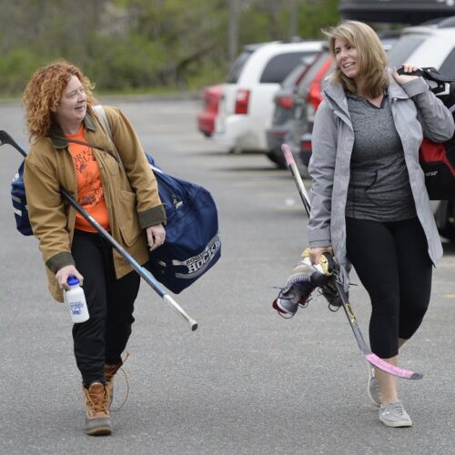 Family headed to the sports arena wearing thick clothing and layers