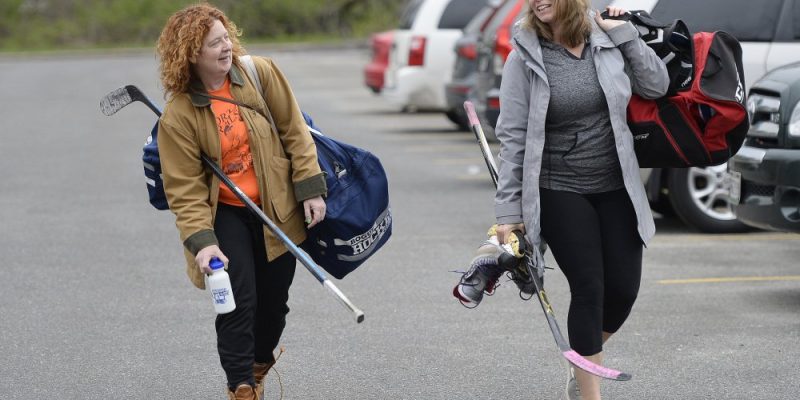 Family headed to the sports arena wearing thick clothing and layers
