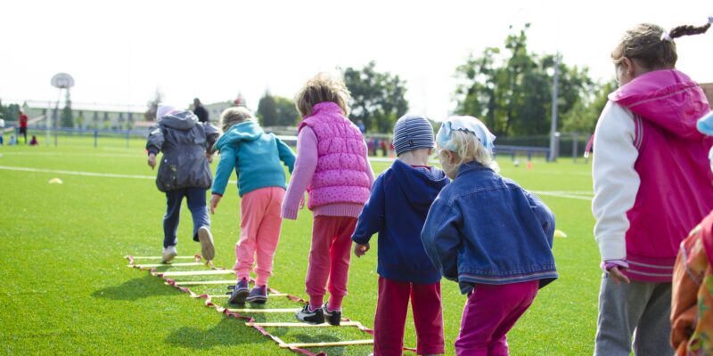 kids warming up with outside activities before getting ready to play