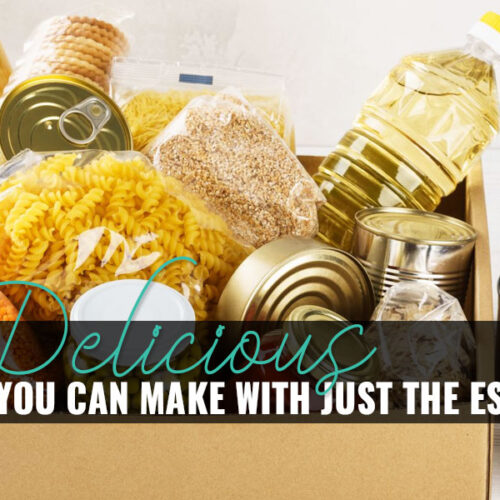 A box with jars of various pasta, grains, rice, and canned food