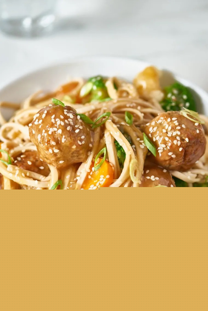 Bowl of pasta with meatballs and vegetables