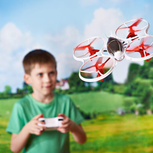 Kid flying a mini drone