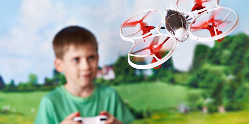 Kid flying a mini drone