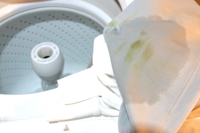 Grass stain on white material