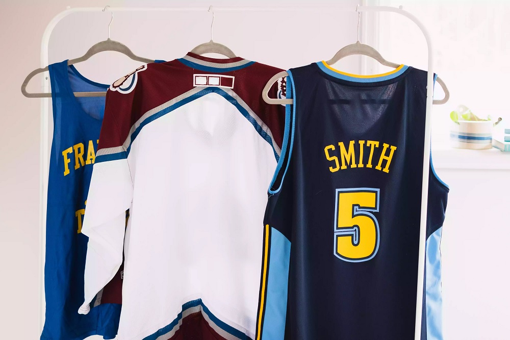 Sports uniforms air drying on hangers