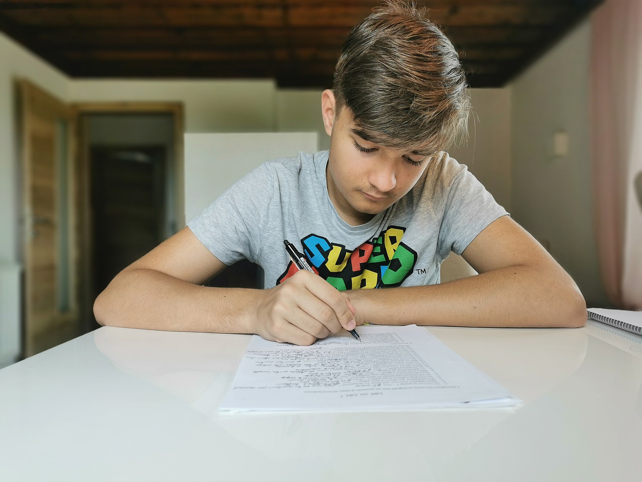 Teen athlete writing in journal