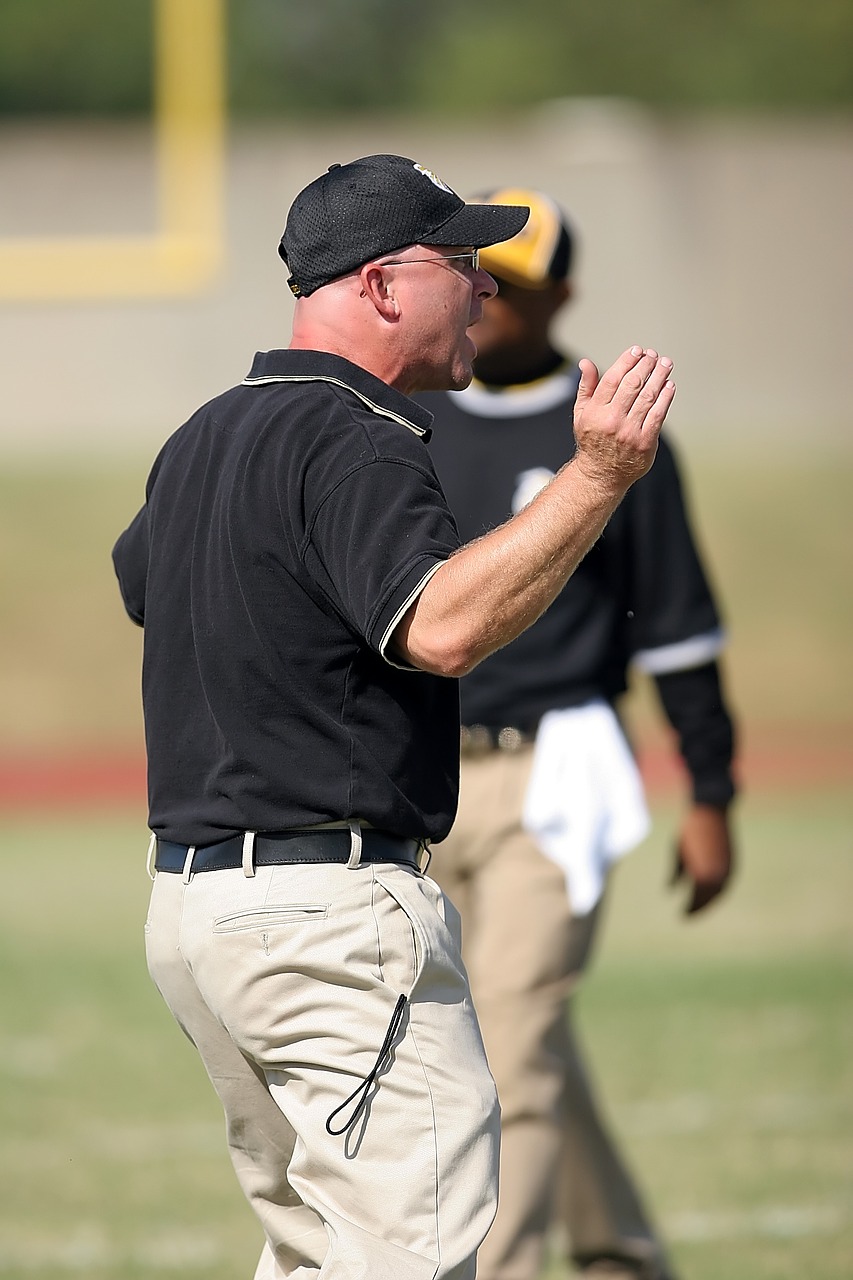 Coach yelling on field during game