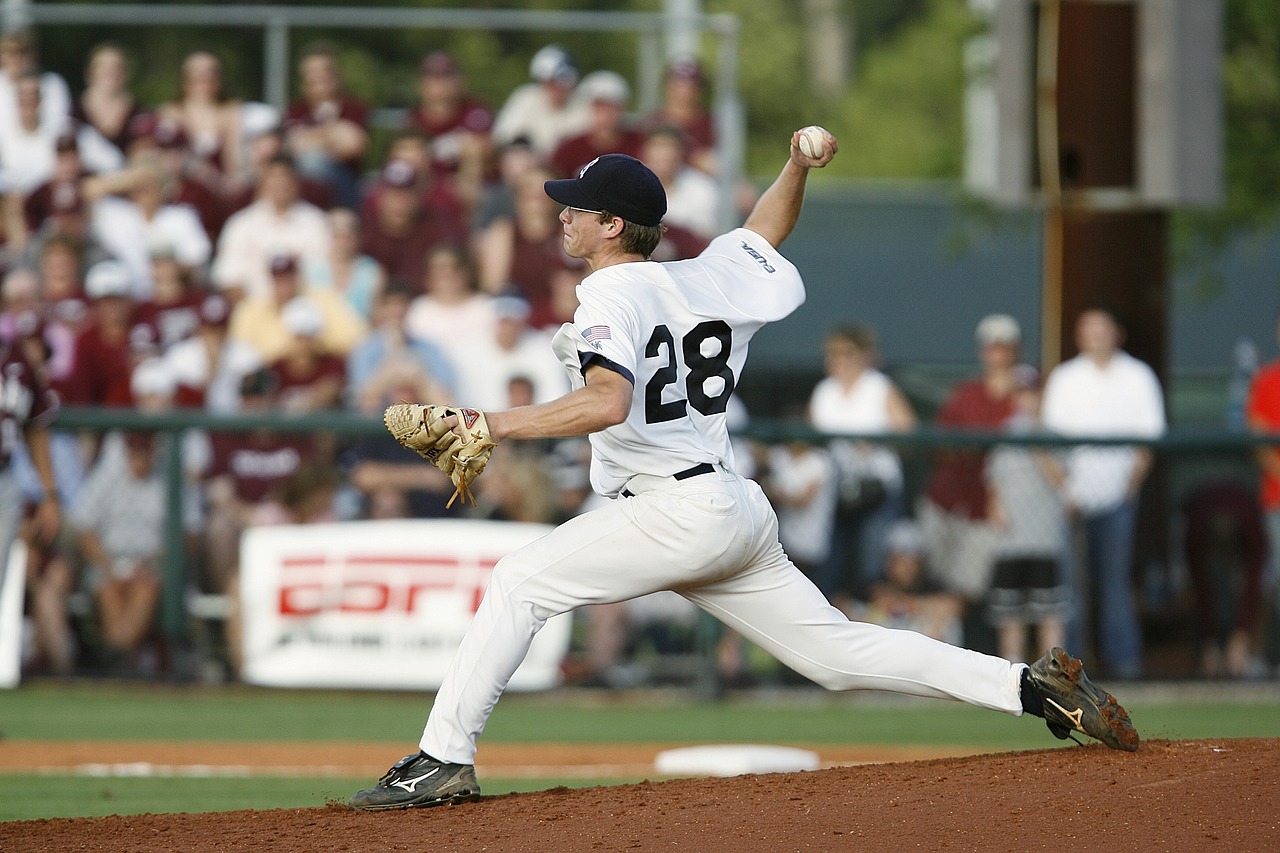 Baseball player pitching ball during game