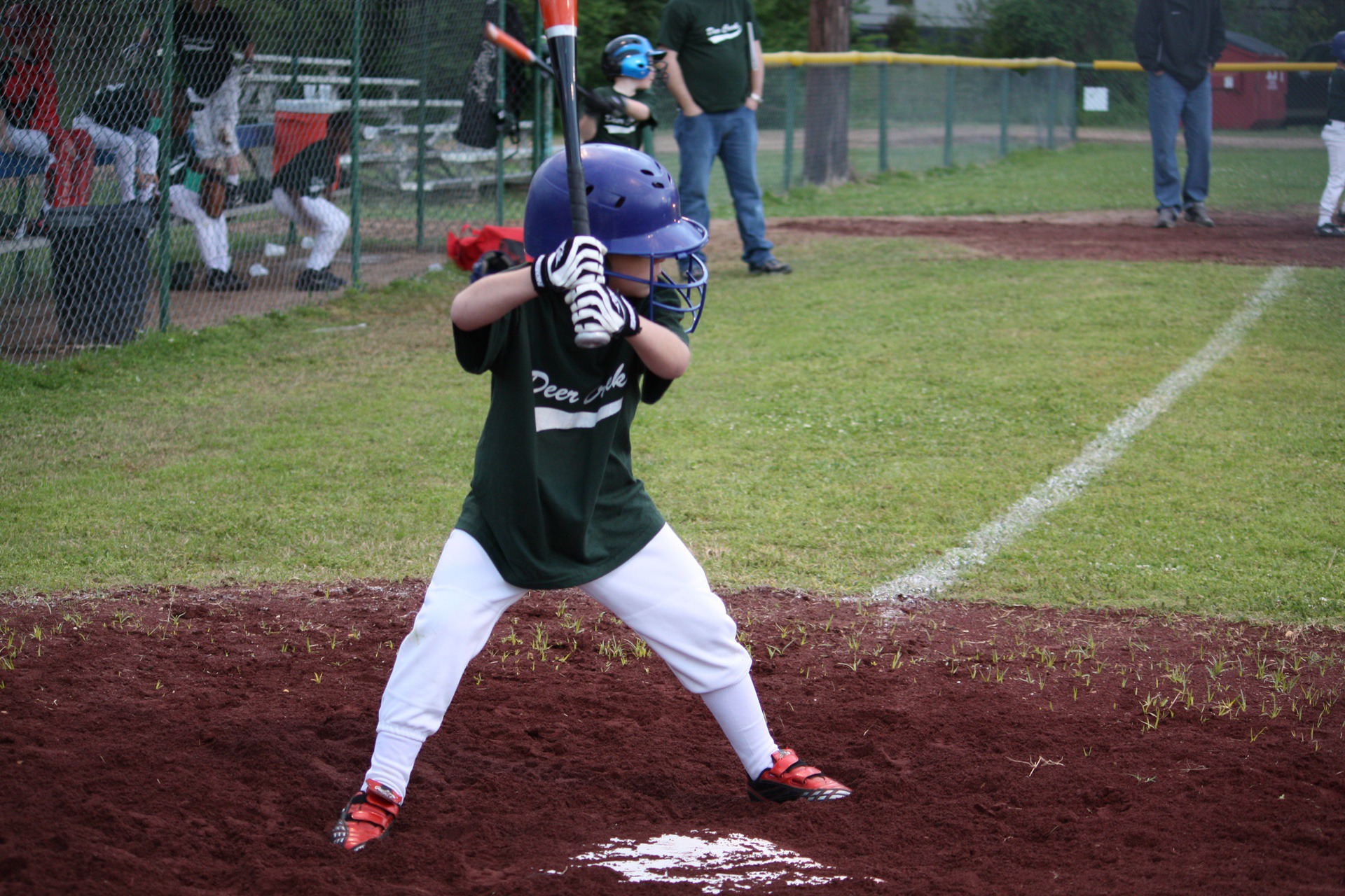 Young person playing baseball at fundraising event